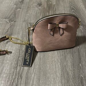 Bow purse 
Baby pink